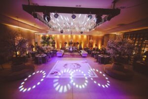 Opulent ballroom setting with chandeliers and sophisticated decor, ideal for upscale events. Miami Event Lighting Decor & Venue Lighting Design with Gobo Monogram, Up‑Lighting • Bistro Lights • Gobo Projection • Dance Floor FX  
Sound | Lighting | Experience  